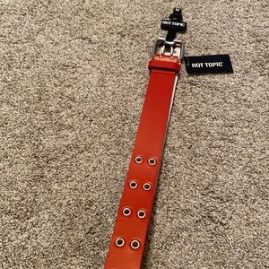 red grommet belt, vintage, retro, upscale.